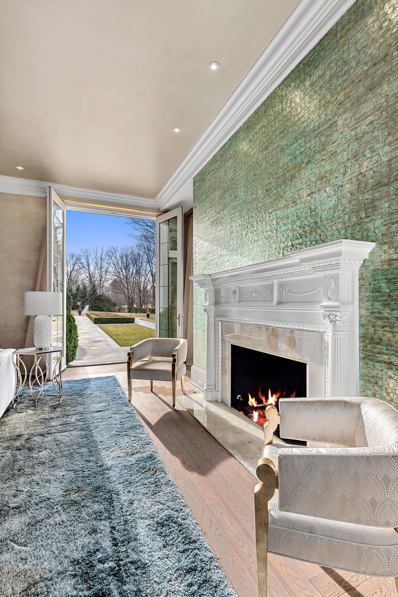 19 Lower Cross Road Greenwich, CT 06831 - Photo 6 of 36 a living room with furniture and a fireplace