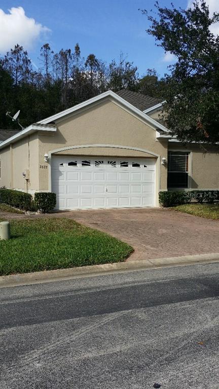 7633 Wimpole Drive New Port Richey, FL 34655 - Photo 1 of 1 a view of a house with a yard