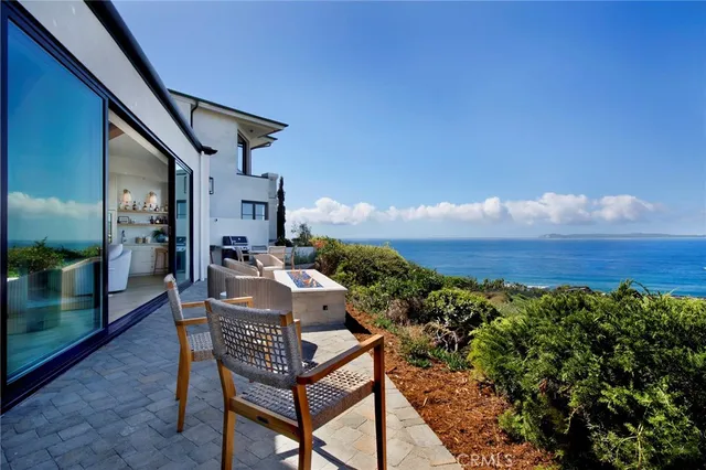 a view of a balcony with furniture