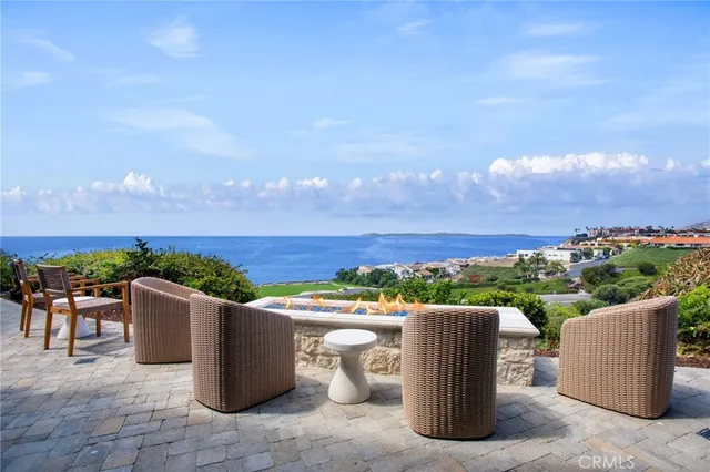 a view of a terrace with a table and chairs