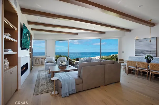 a living room with furniture window and wooden floor