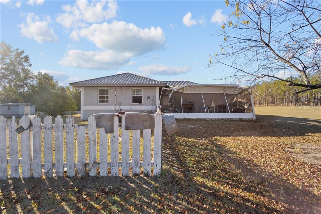 13691 201st Road Live Oak, FL 32060 - Photo 1 of 36 a view of a house with a yard