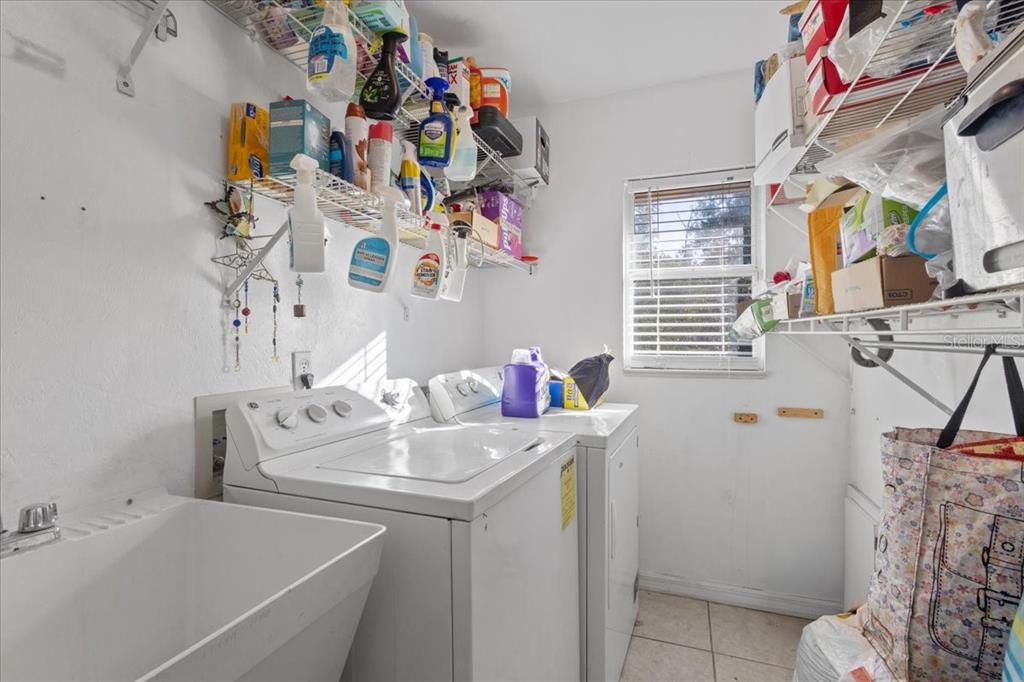 13691 201st Road Live Oak, FL 32060 - Photo 11 of 36 a utility room with a sink dryer and washer