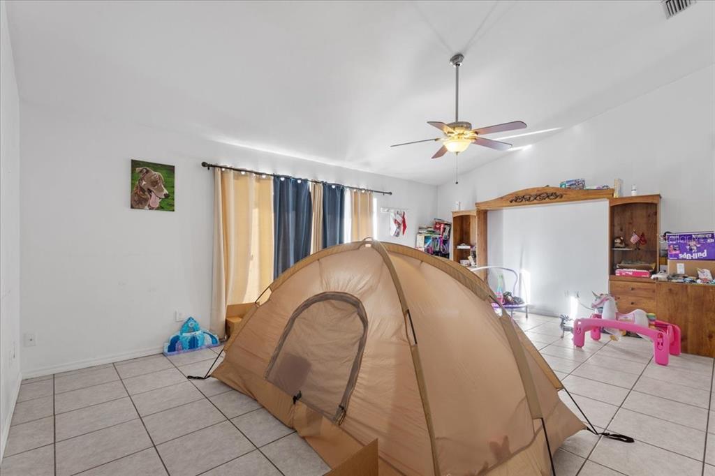 13691 201st Road Live Oak, FL 32060 - Photo 2 of 36 a view of a livingroom with furniture and a ceiling fan