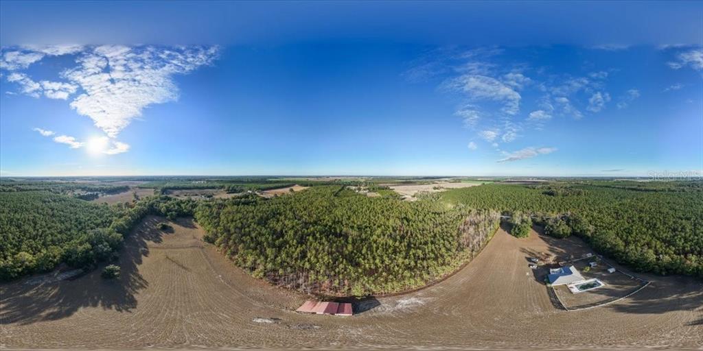 13691 201st Road Live Oak, FL 32060 - Photo 29 of 36 a view of a lake with a beach