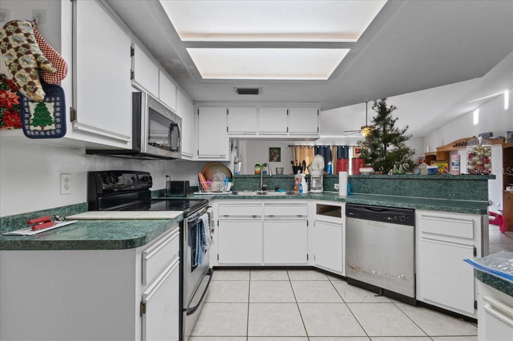13691 201st Road Live Oak, FL 32060 - Photo 6 of 36 a kitchen with stainless steel appliances granite countertop a sink and cabinets