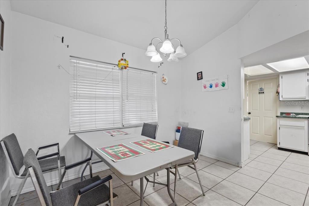 13691 201st Road Live Oak, FL 32060 - Photo 8 of 36 a view of a dining room with furniture and chandelier