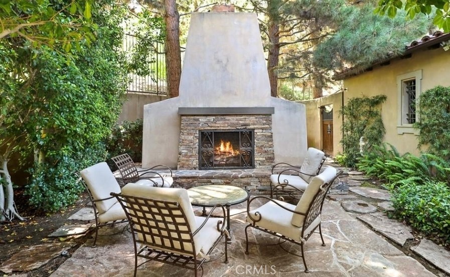 48 Arborside Irvine, CA 92603 - Photo 37 of 37 Outdoor cozy fireplace. (Clubhouse)