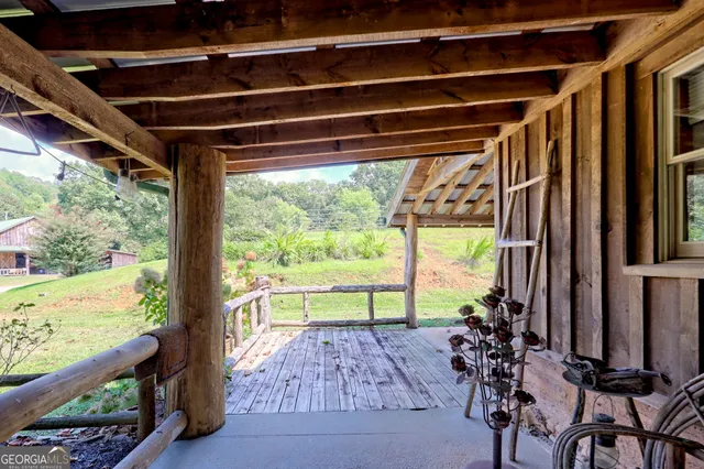 a bathroom with a granite countertop shower and a sink