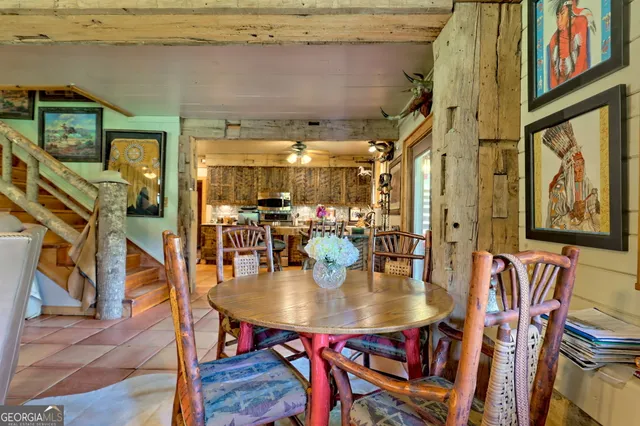a living room with furniture a rug and a fireplace