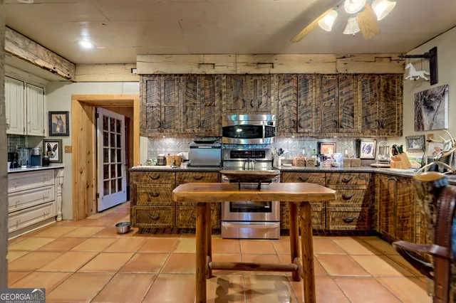 a living room with furniture a rug and a window