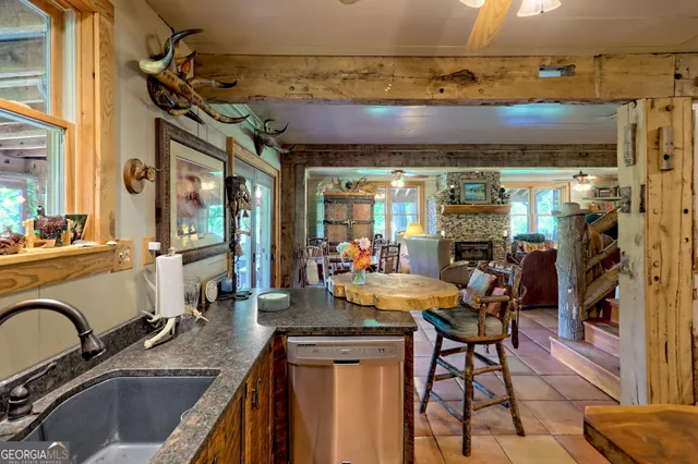 a view of a backyard with table and chairs and potted plants