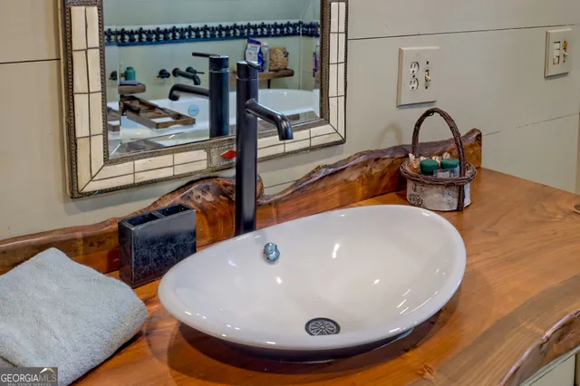 a backyard of a house with lots of green space and fountain