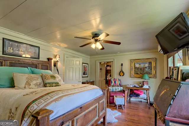 an aerial view of a house with a yard basket ball court and outdoor seating