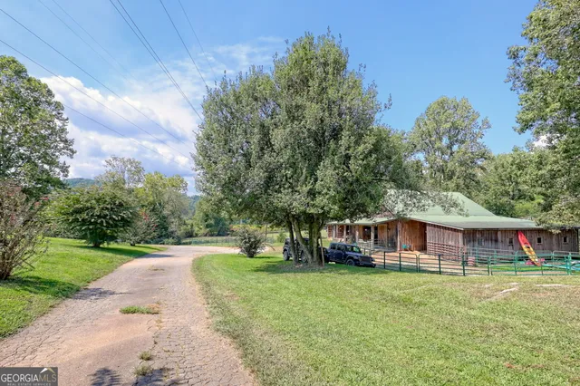a kitchen with stainless steel appliances kitchen island granite countertop a sink and cabinets