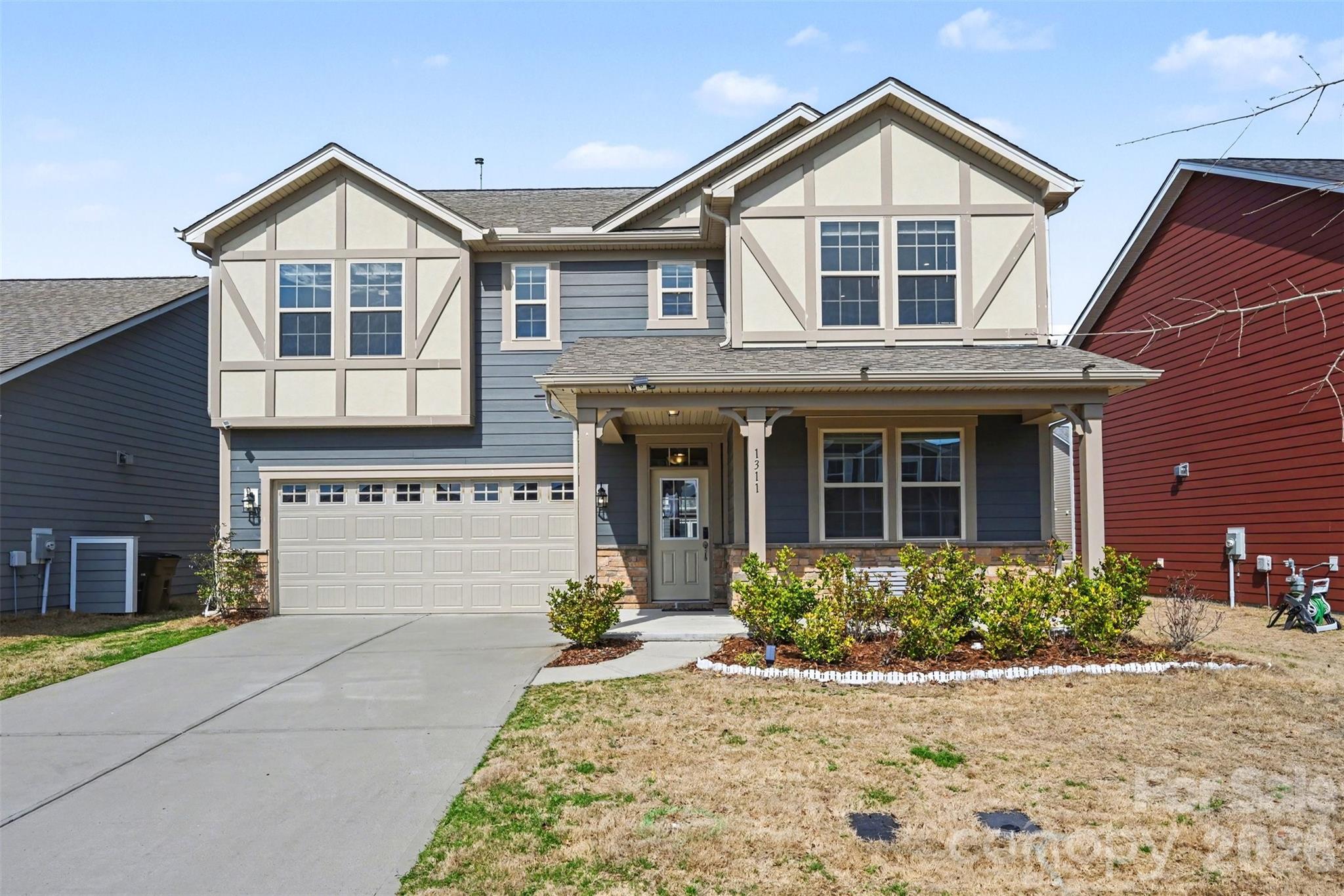 a front view of a house with garden