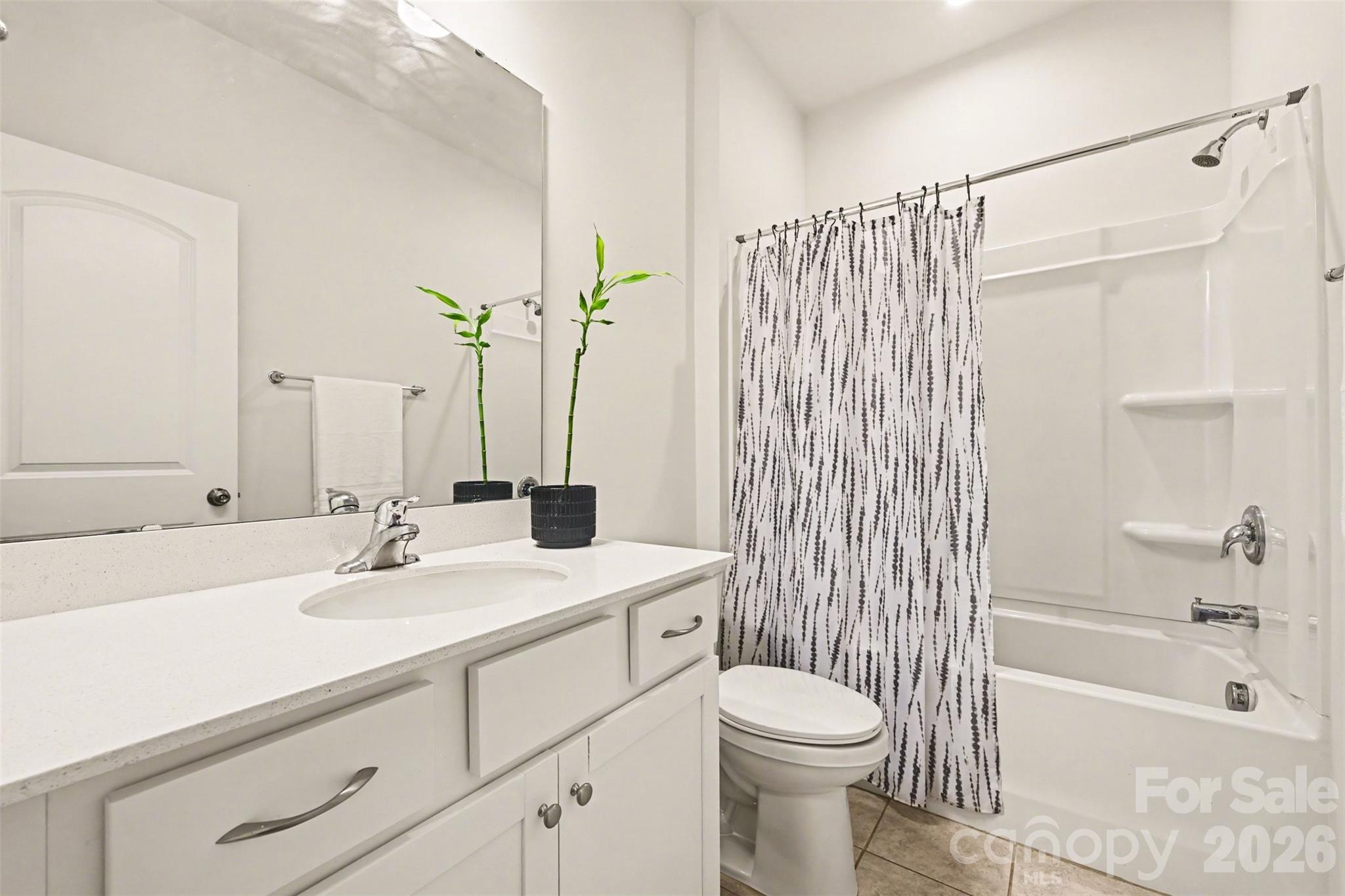 1311 Tollcross Road Indian Trail, NC 28079 - Photo 11 of 34 a bathroom with a sink a toilet and shower