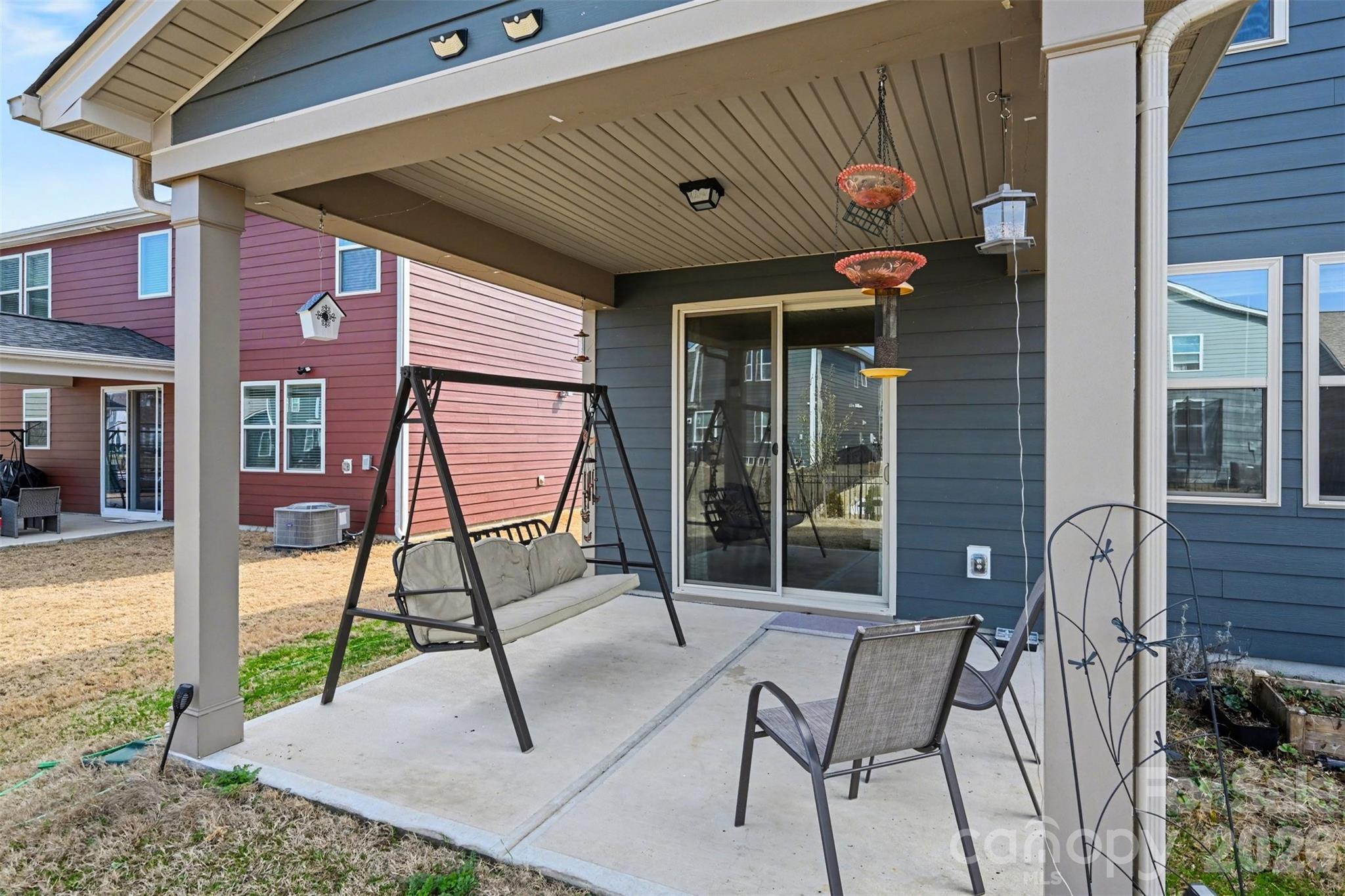 1311 Tollcross Road Indian Trail, NC 28079 - Photo 24 of 34 a view of a patio with a table and chairs