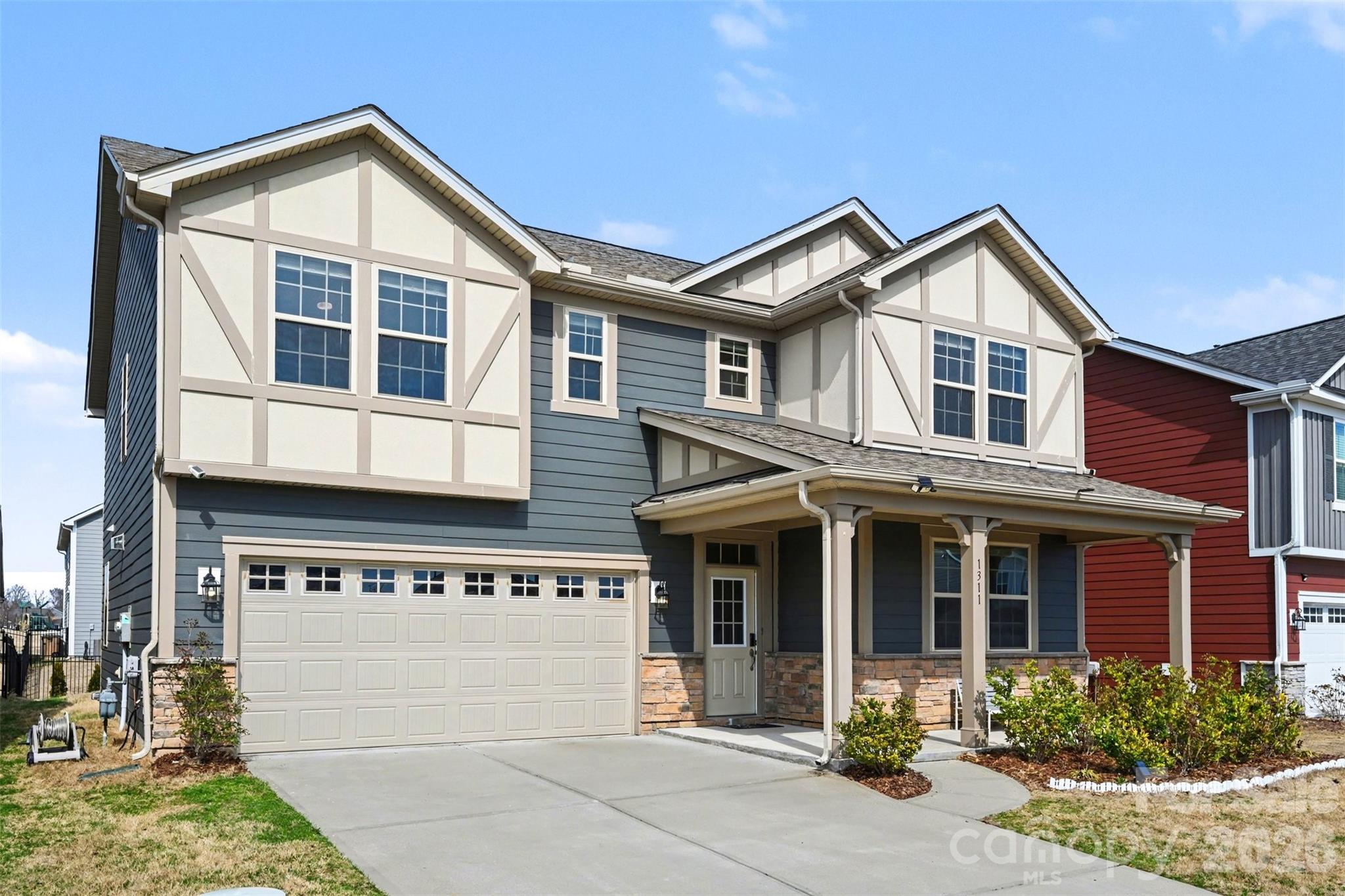 1311 Tollcross Road Indian Trail, NC 28079 - Photo 29 of 34 a front view of a house with yard and garage