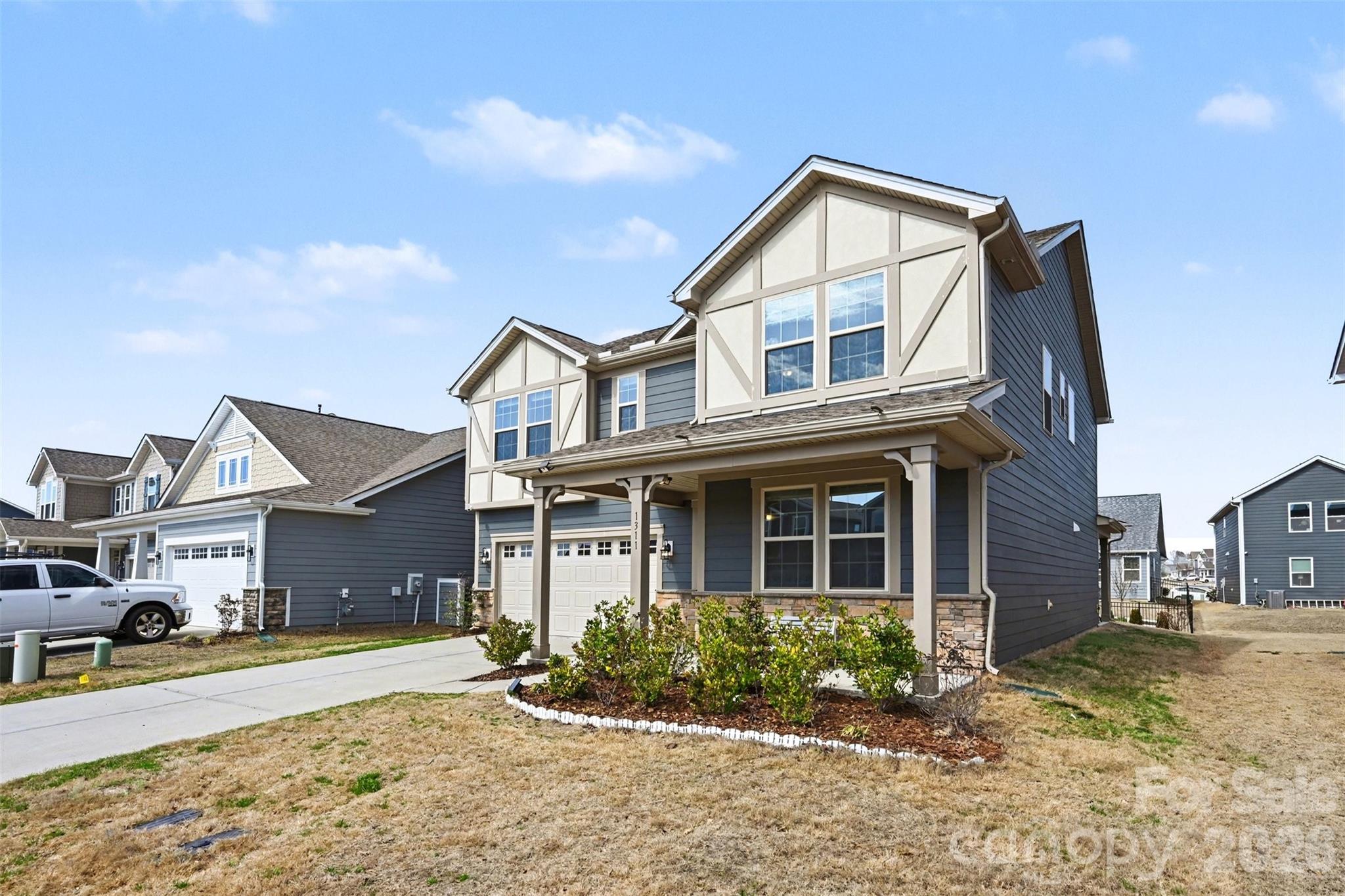 1311 Tollcross Road Indian Trail, NC 28079 - Photo 30 of 34 a front view of a house with a yard