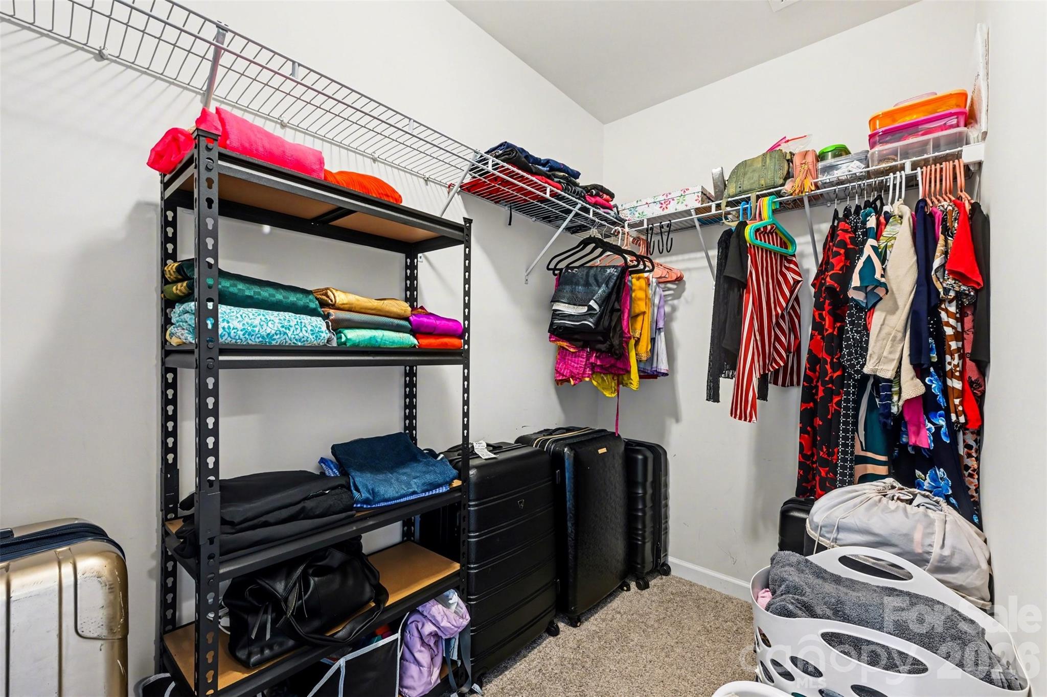 1311 Tollcross Road Indian Trail, NC 28079 - Photo 34 of 34 a view of walk in closet with clothes