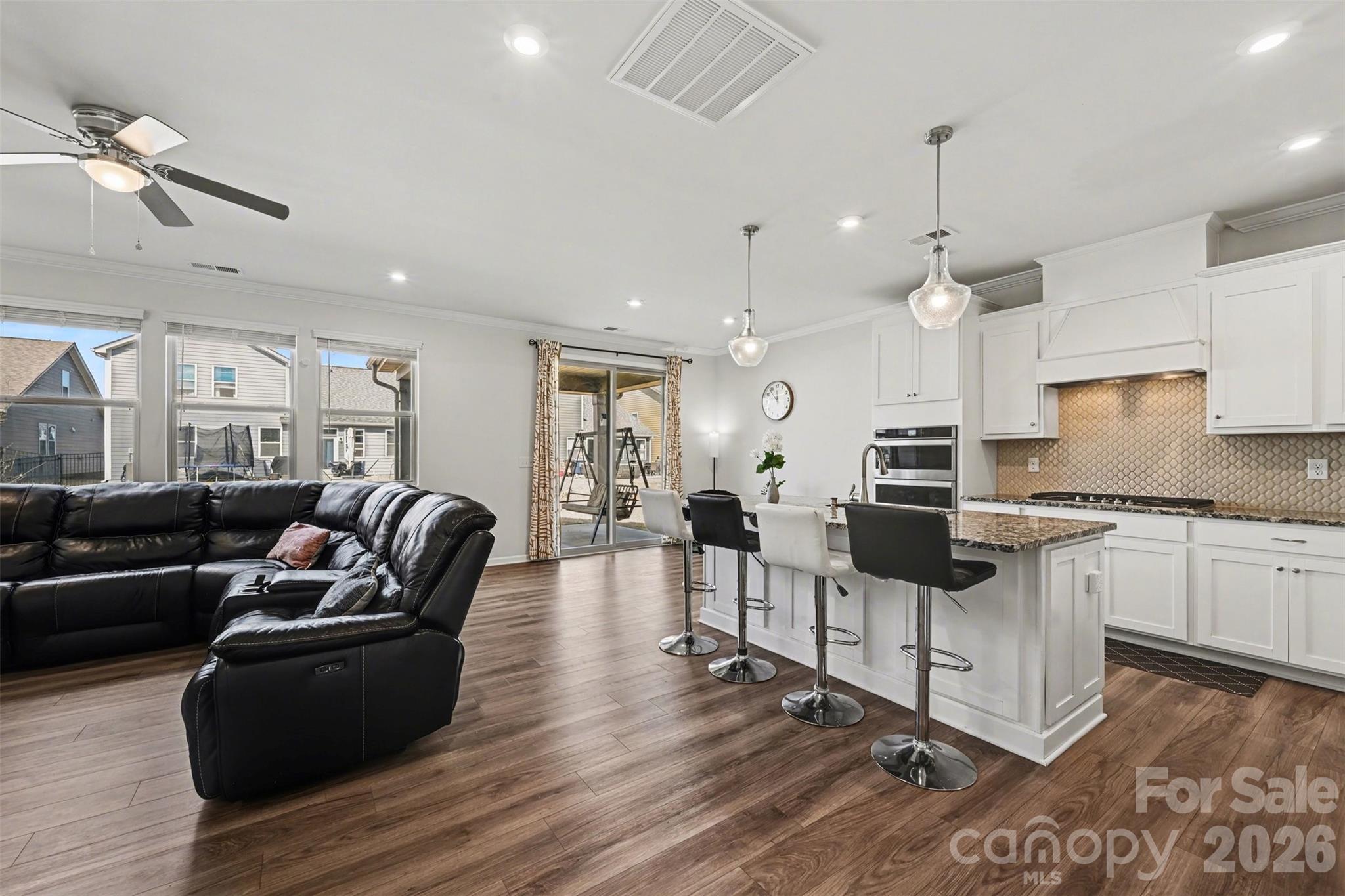 1311 Tollcross Road Indian Trail, NC 28079 - Photo 4 of 34 a living room with furniture and kitchen view