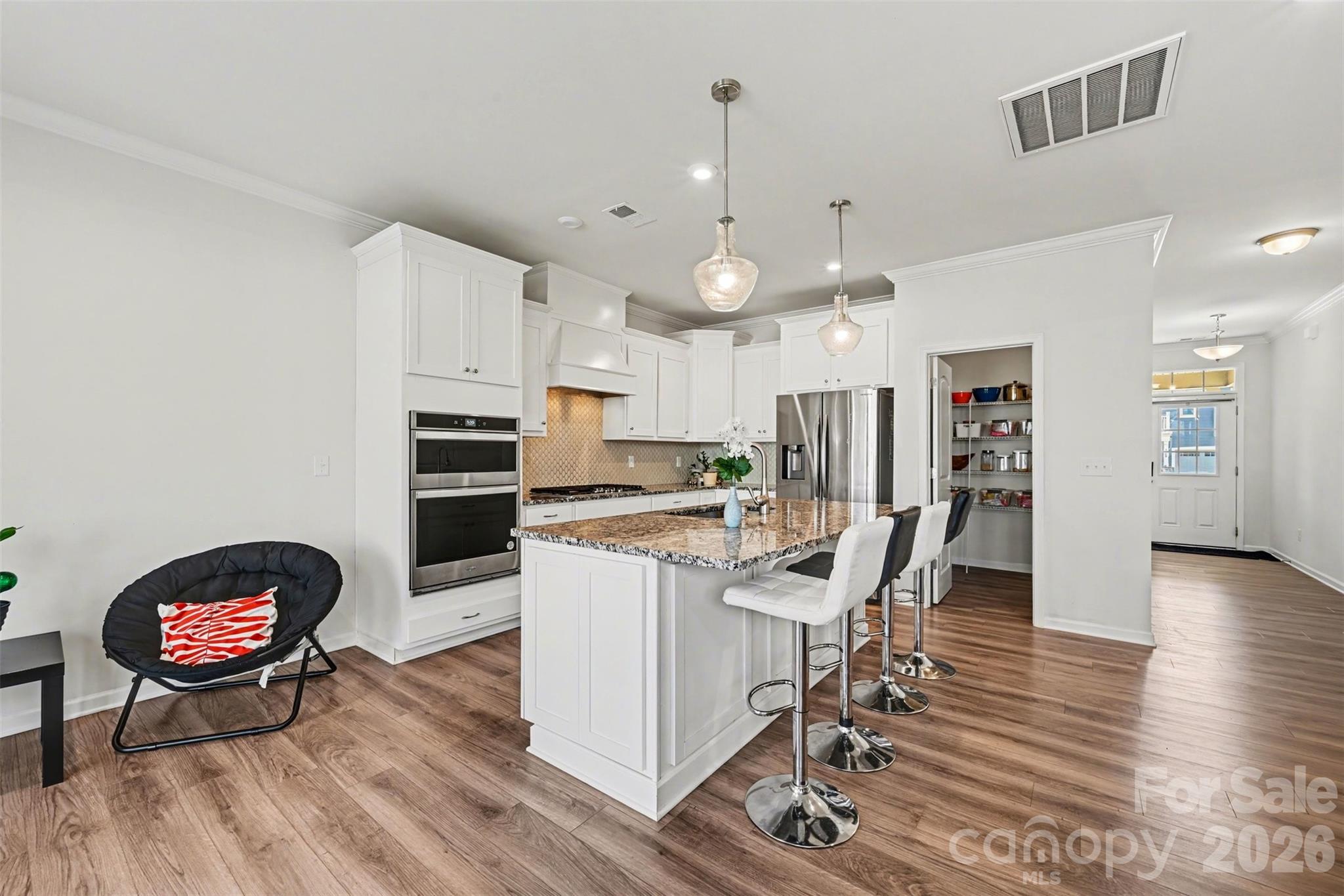 1311 Tollcross Road Indian Trail, NC 28079 - Photo 5 of 34 a view of a kitchen and dining room