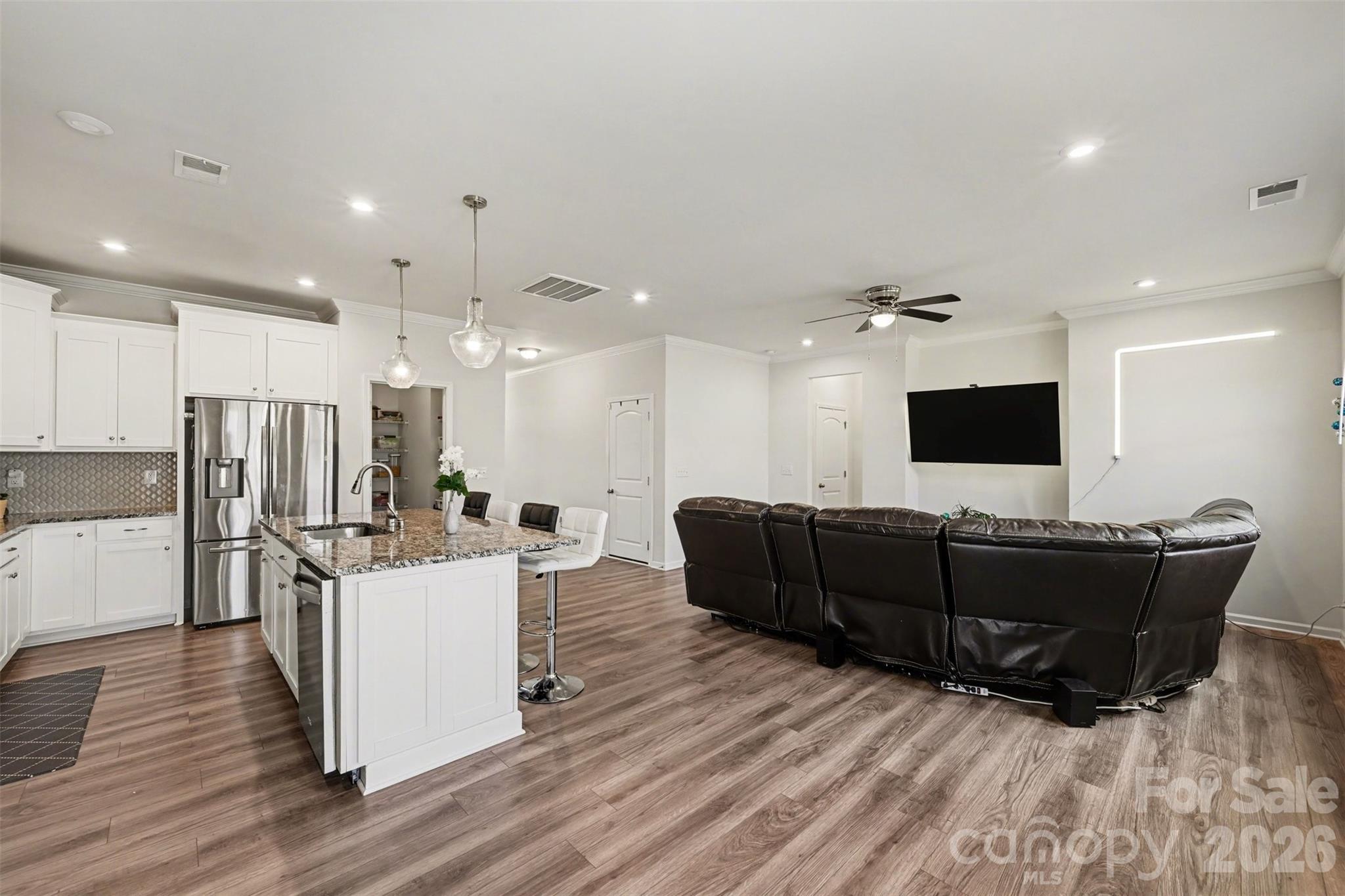 1311 Tollcross Road Indian Trail, NC 28079 - Photo 8 of 34 a living room with furniture and a flat screen tv