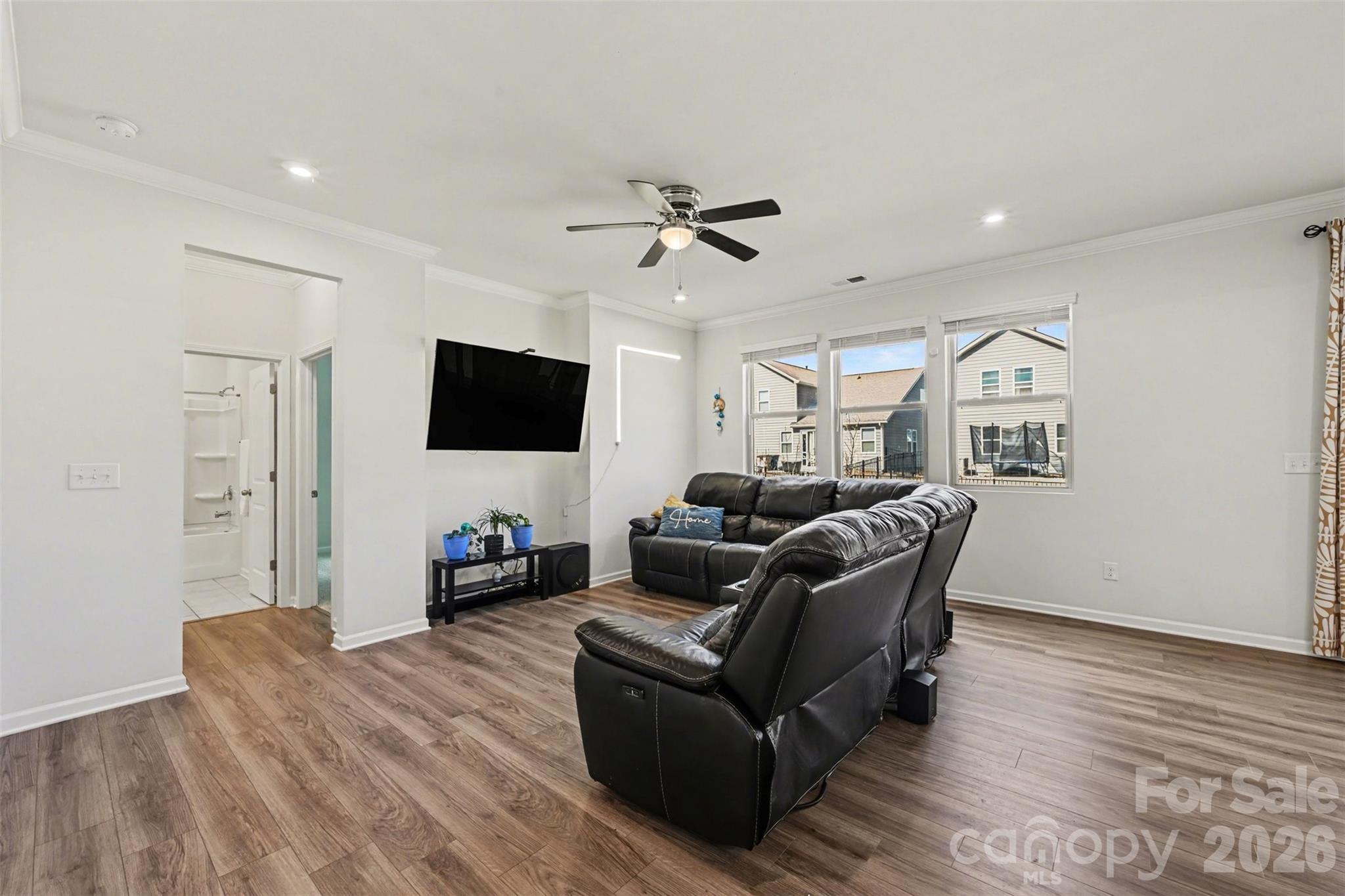 1311 Tollcross Road Indian Trail, NC 28079 - Photo 9 of 34 a living room with furniture and a flat screen tv