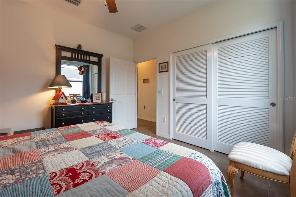 15969 Southwest 14th Avenue Road Ocala, FL 34473 - Photo 32 of 46 a bed room with a bed and a television
