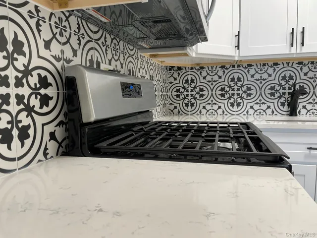 a bathroom with a stove and a shower