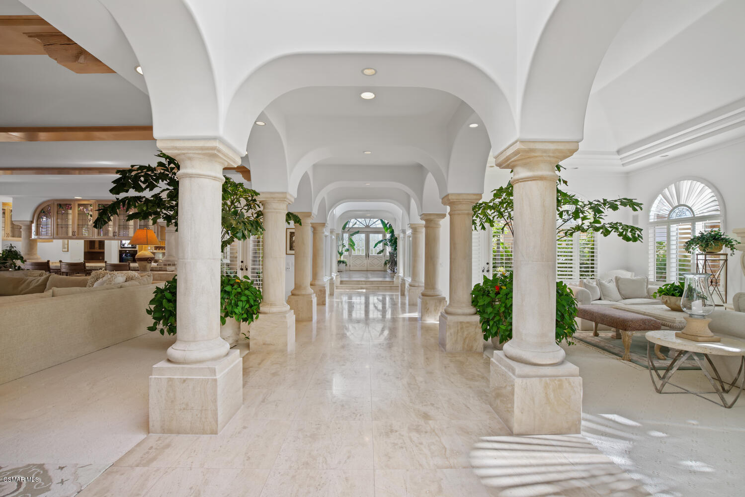 6021 John Muir Road Hidden Hills, CA 91302 - Photo 13 of 74 a living room with furniture and a potted plant