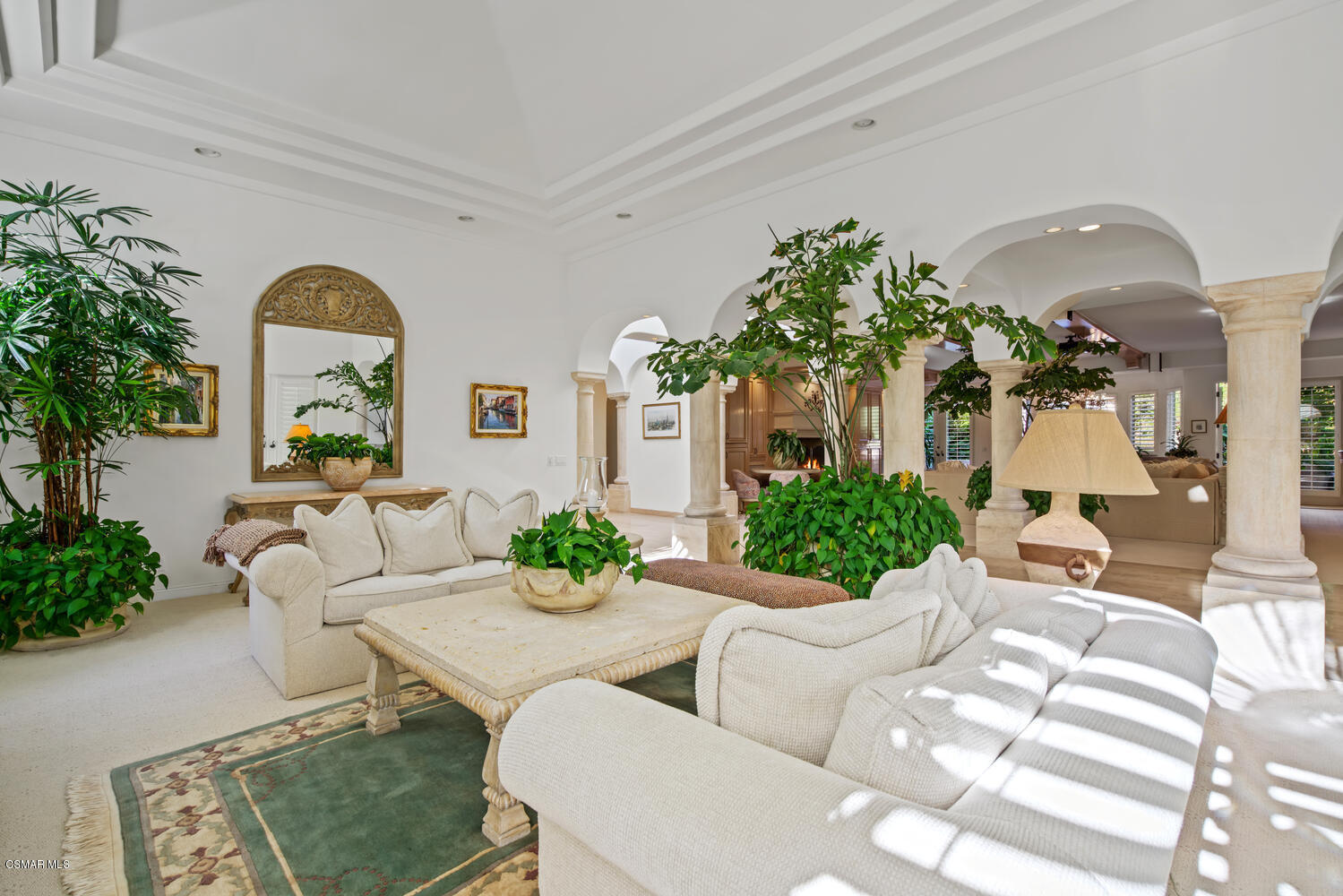6021 John Muir Road Hidden Hills, CA 91302 - Photo 17 of 74 a living room with furniture fireplace and potted plant