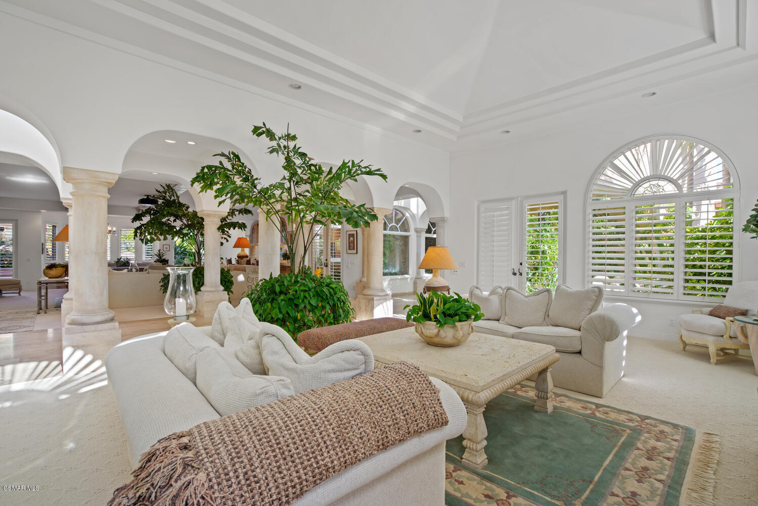 6021 John Muir Road Hidden Hills, CA 91302 - Photo 18 of 74 a living room with furniture chandelier and a large window