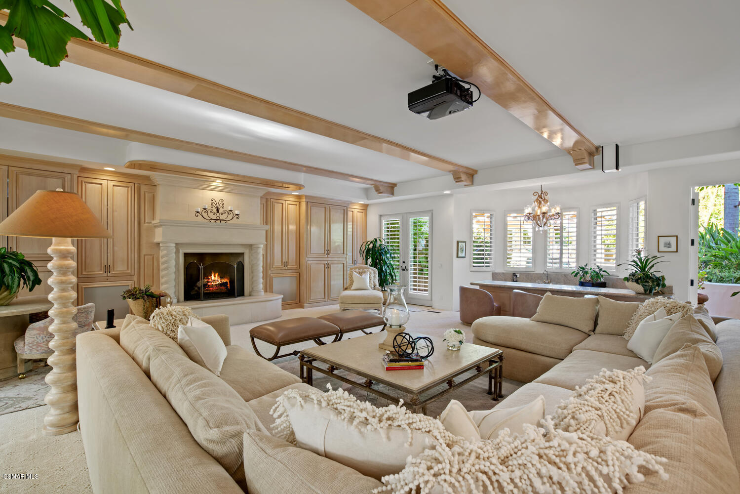 6021 John Muir Road Hidden Hills, CA 91302 - Photo 22 of 74 a living room with furniture fireplace and a large window