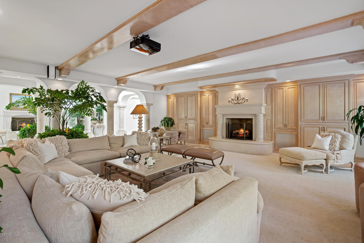 6021 John Muir Road Hidden Hills, CA 91302 - Photo 23 of 74 a living room with furniture and a large window