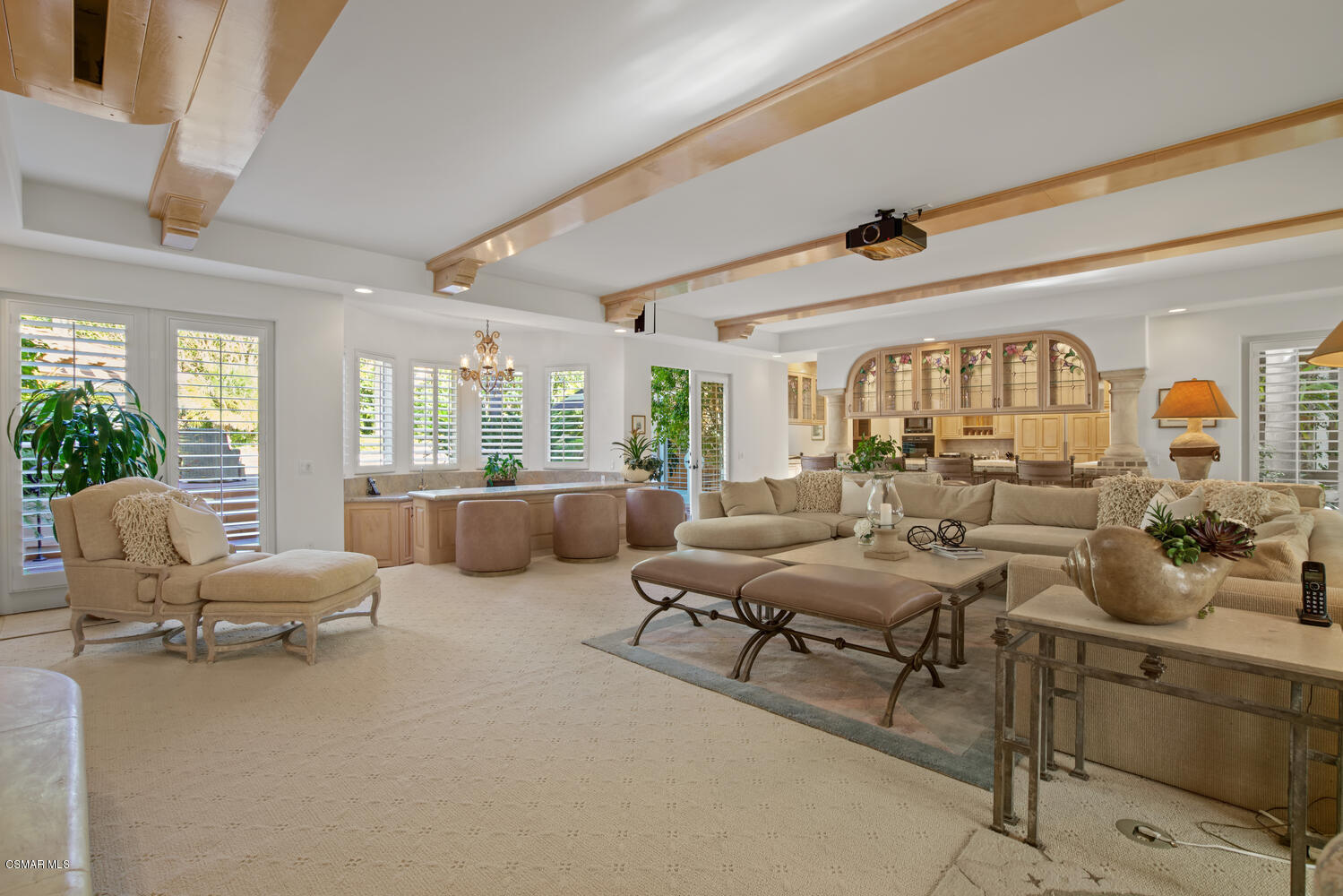 6021 John Muir Road Hidden Hills, CA 91302 - Photo 26 of 74 a living room with furniture and a large window