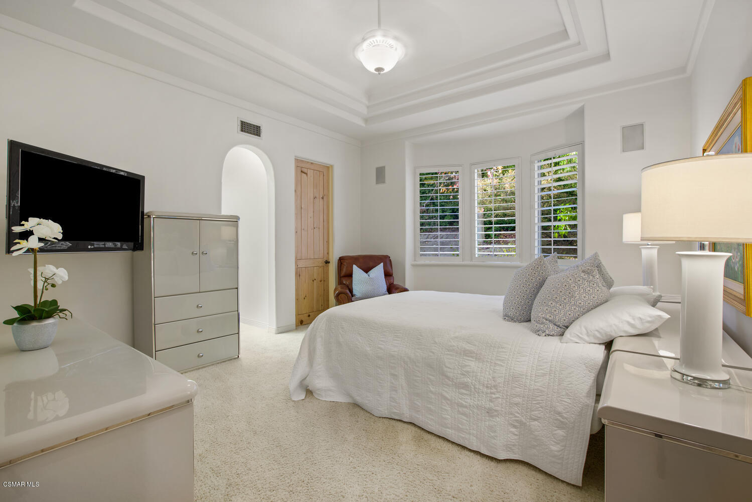 6021 John Muir Road Hidden Hills, CA 91302 - Photo 41 of 74 a bedroom with a bed and flat screen tv