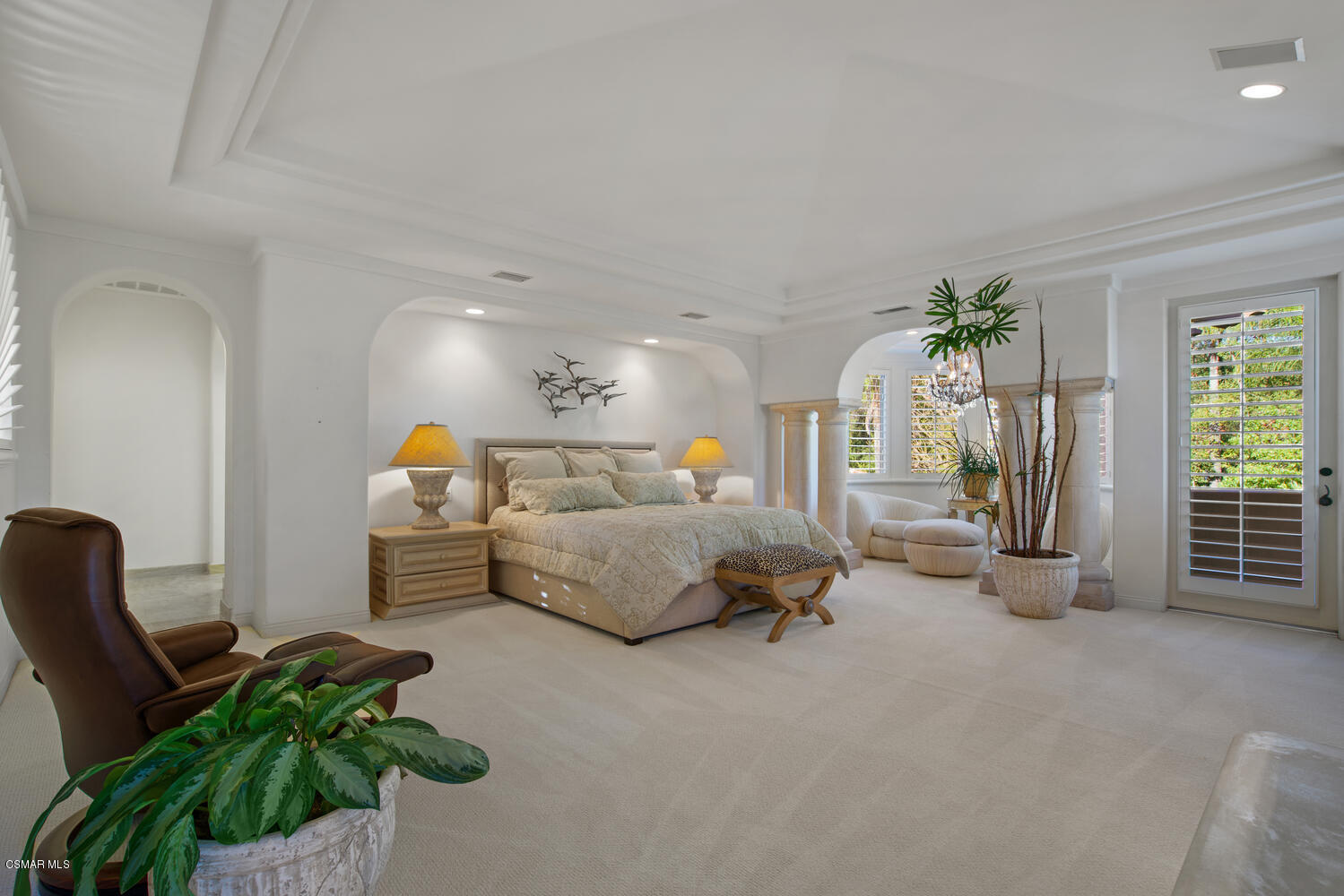 6021 John Muir Road Hidden Hills, CA 91302 - Photo 47 of 74 a living room with furniture and a potted plant