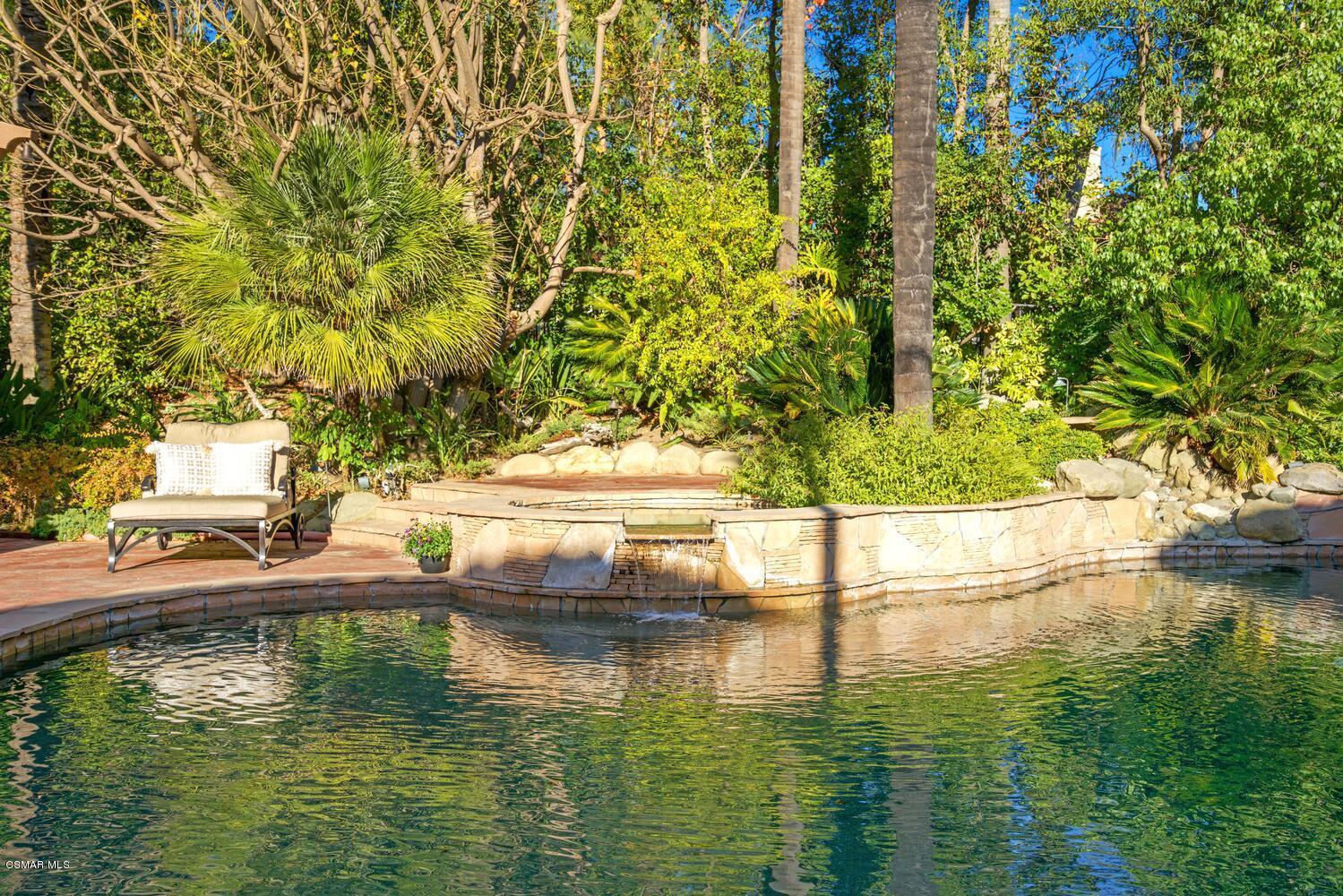 6021 John Muir Road Hidden Hills, CA 91302 - Photo 62 of 74 a view of swimming pool with a yard