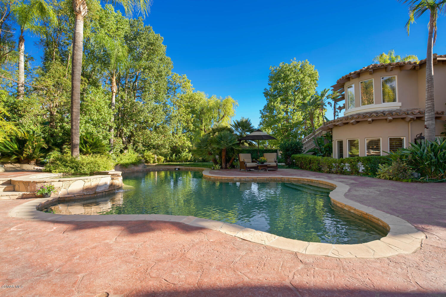 6021 John Muir Road Hidden Hills, CA 91302 - Photo 63 of 74 a view of a lake with a house