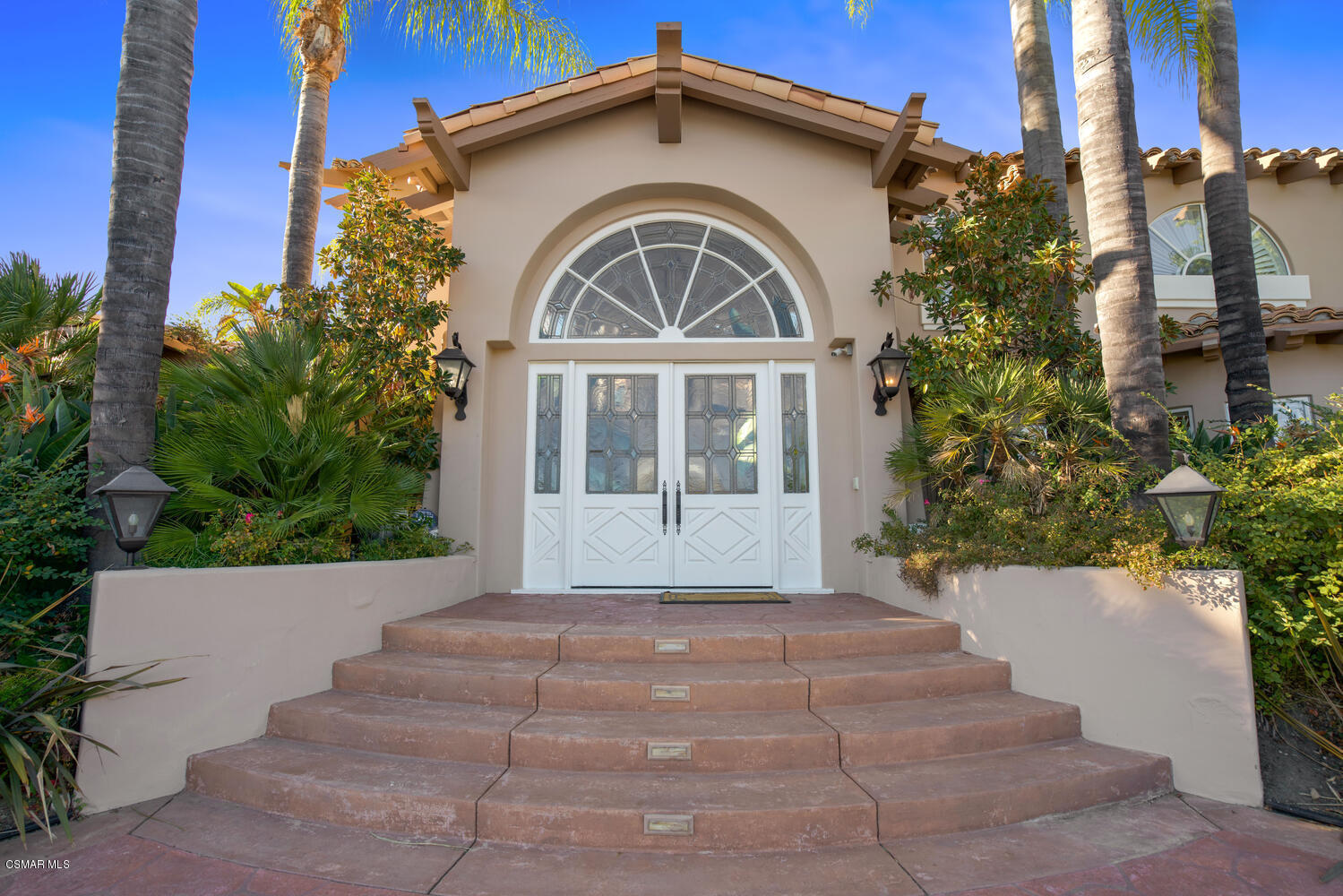 6021 John Muir Road Hidden Hills, CA 91302 - Photo 9 of 74 a front view of a house with a yard