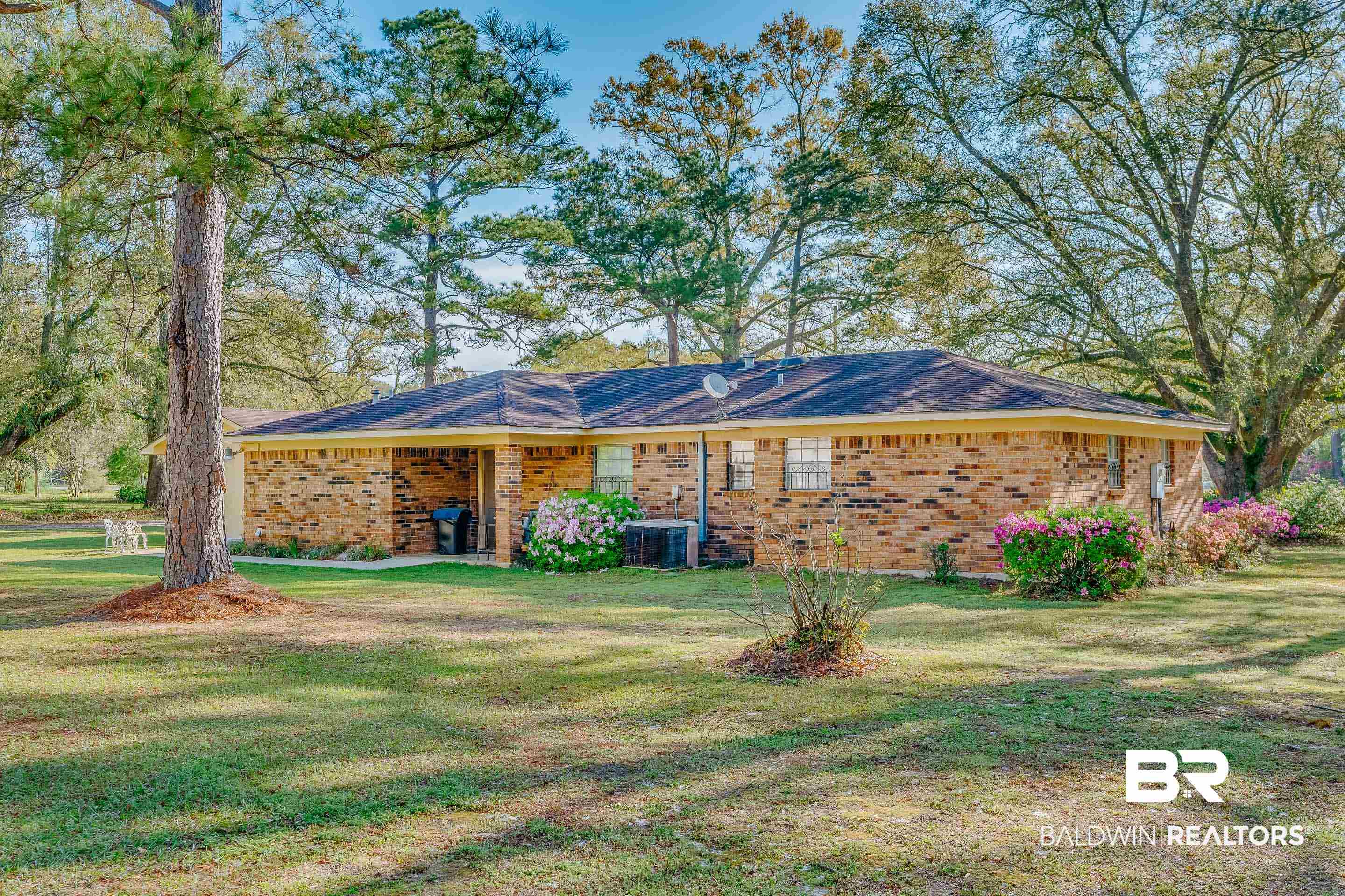 5151 McCrary Road Semmes, AL 36575 - Photo 23 of 62 Ranch-style home featuring a front lawn, brick siding, and cooling unit
