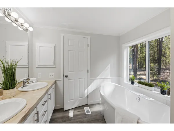 a bathroom with a sink and a large mirror