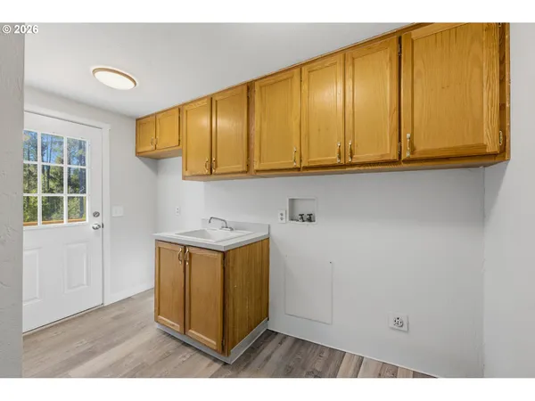 a kitchen with a sink and cabinets