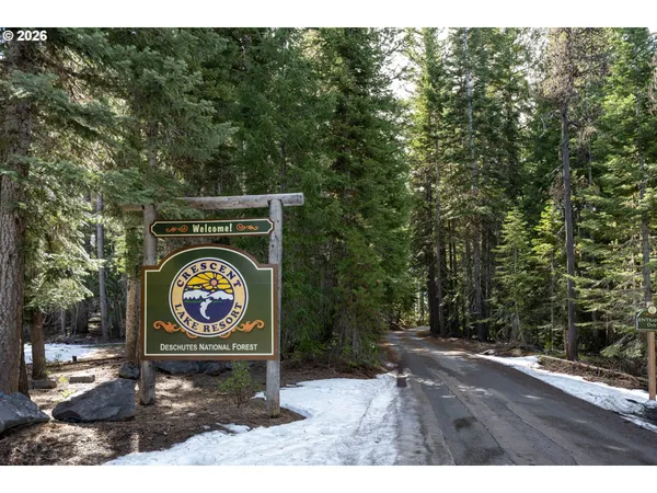 a sign that is on a brick wall