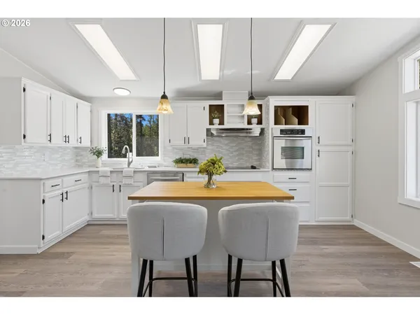 a dinning table and chairs in the kitchen