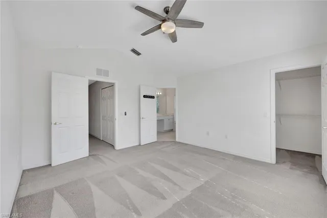 a spacious bathroom with a double vanity sink and a mirror