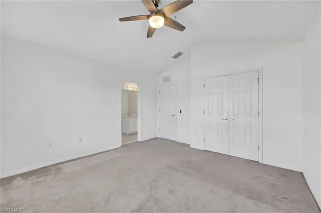 a bathroom with a double vanity sink mirror and toilet
