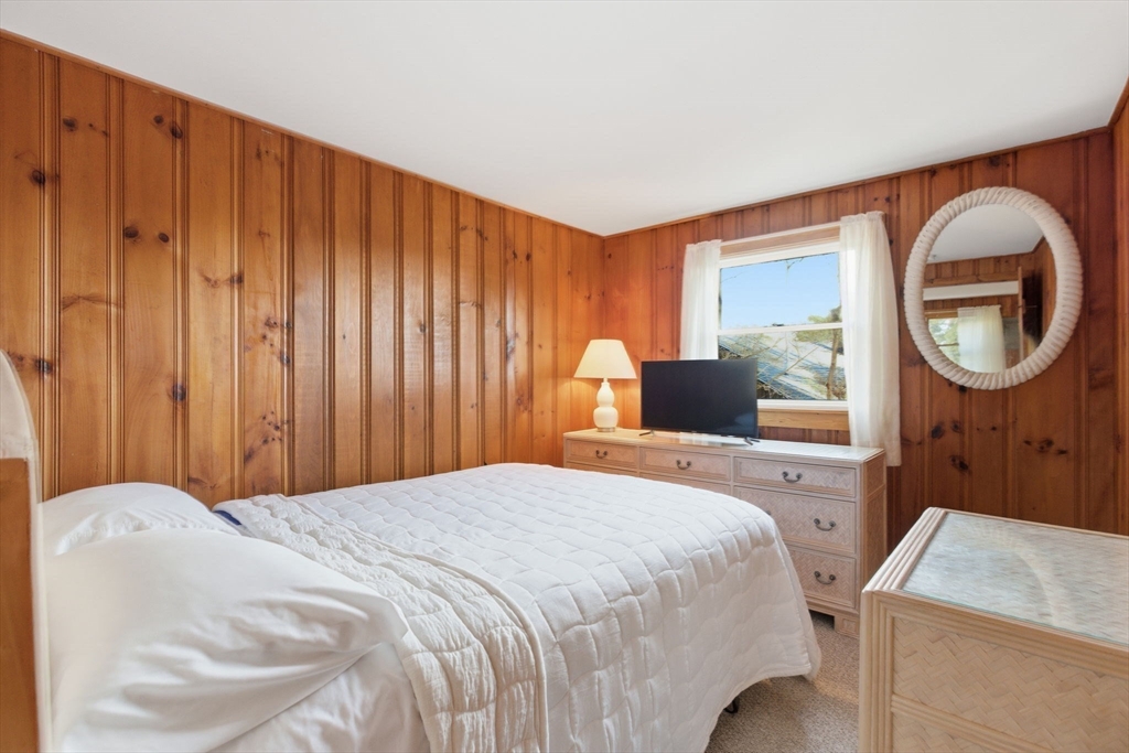 3 W Road Sandwich, MA 02644 - Photo 13 of 15 a bedroom with a bed and a mirror
